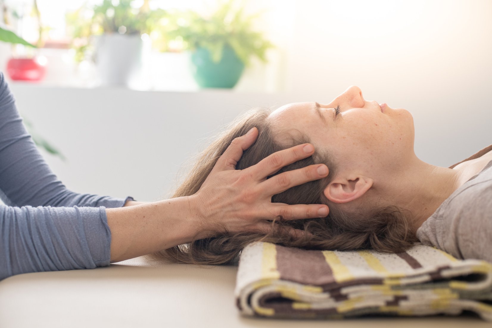 Woman practicing Somatic movement in her Health Studio, Awareness through movement, embodiment and Feldenkrais Method